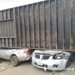 A devastating accident occurred in Lokoja on Thursday when a 40-feet articulated container fell on two vehicles, trapping eight school children inside one of the cars. However, in a miraculous turn of events, all eight children were rescued unhurt.