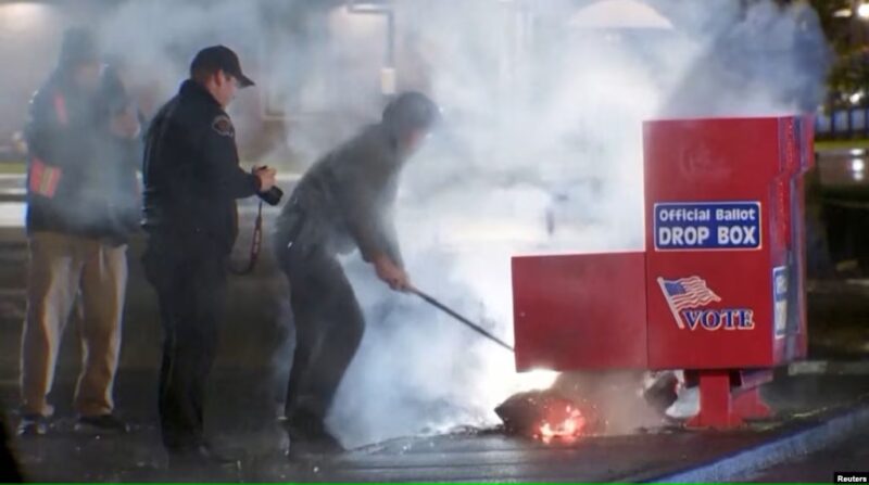 Ballot Boxes Set Ablaze in U.S. Amid Early Voting